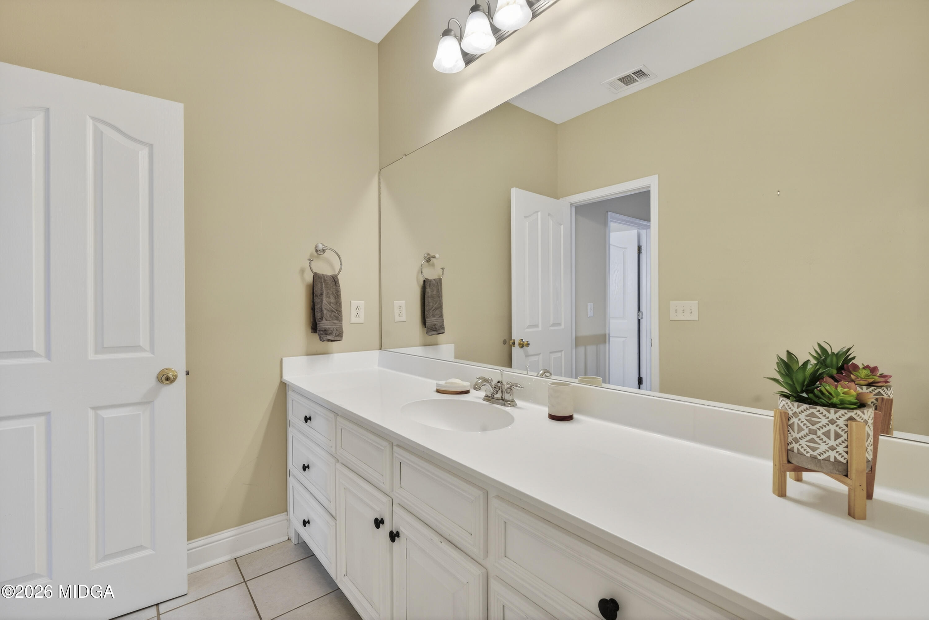 855 Tufthunter Macon, GA 31210 - Photo 68 of 87 a bathroom with a sink and a mirror