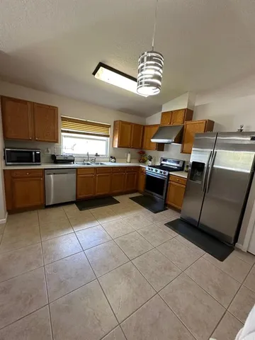 a large kitchen with lots of appliances and cabinets