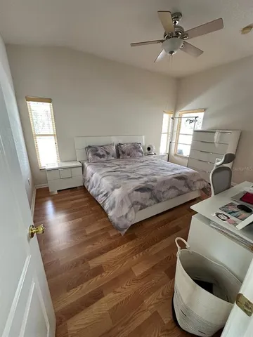 a bedroom with furniture and a window