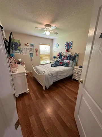 a bedroom with a bed and dresser