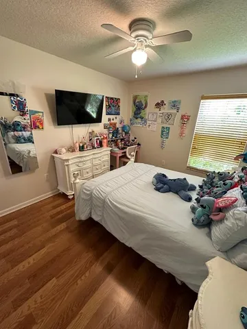 a bedroom with bed or couch and a flat screen tv