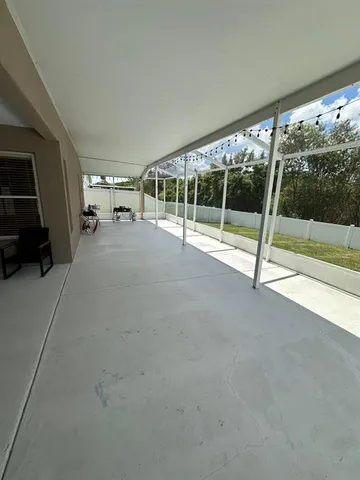 a view of a field with an ocean