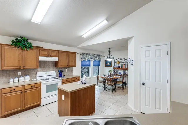 a kitchen with a cabinets and counter top space