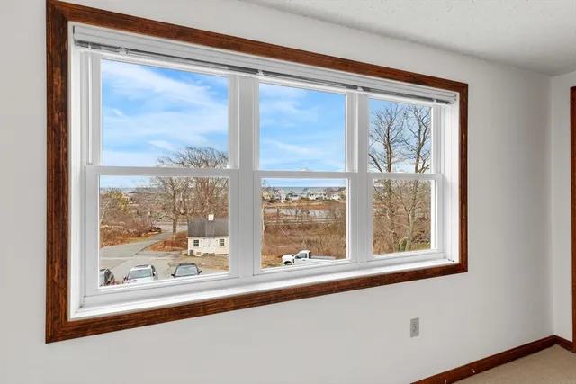 a view of a room that has a large window