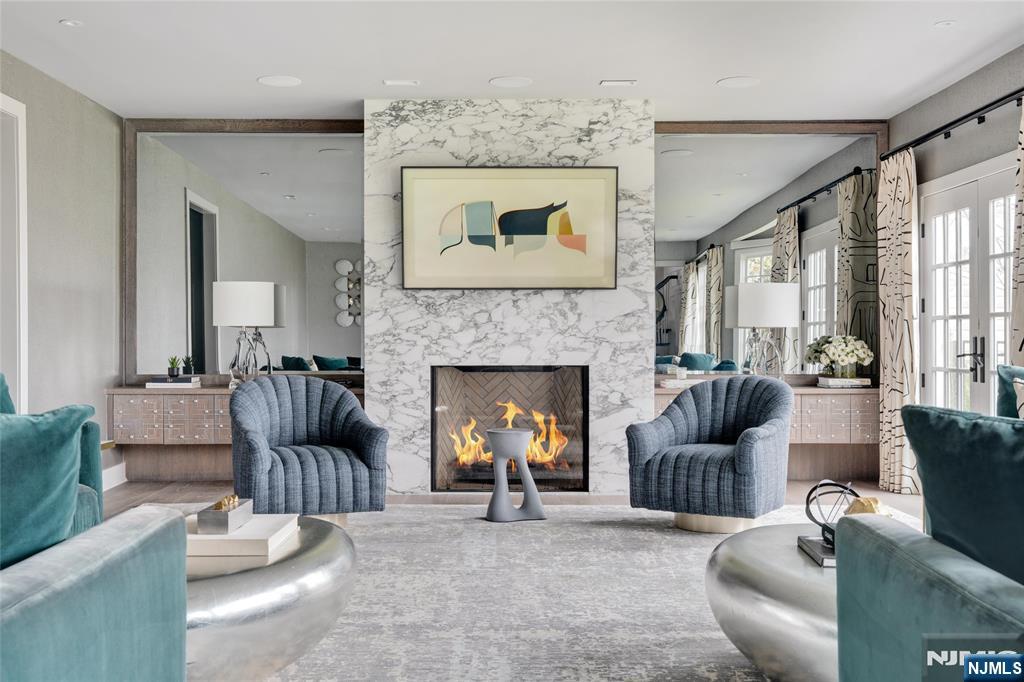 11 Hamilton Road Short Hills, NJ 07078 - Photo 13 of 50 a living room with furniture and a fireplace