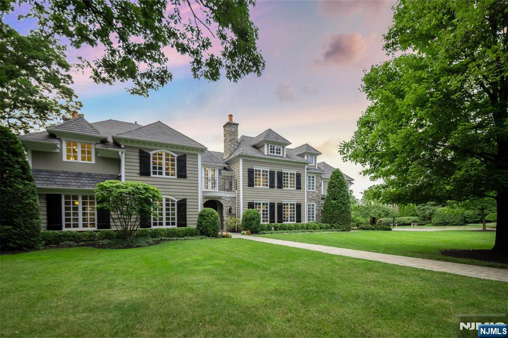 11 Hamilton Road Short Hills, NJ 07078 - Photo 2 of 50 a front view of a house with a garden