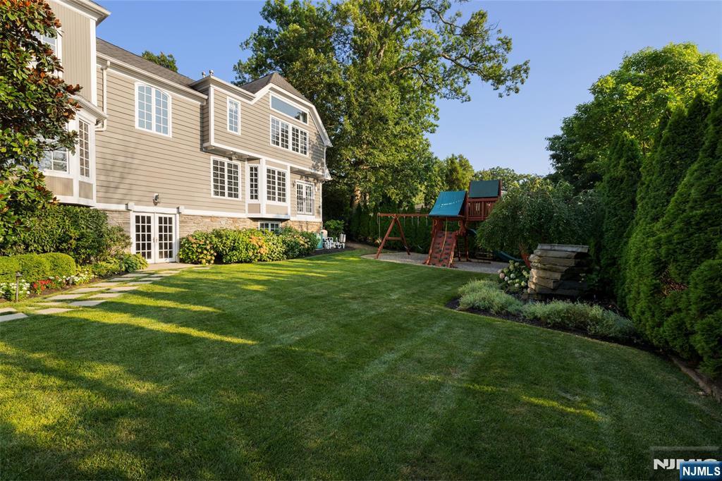 11 Hamilton Road Short Hills, NJ 07078 - Photo 46 of 50 a front view of a house with a yard