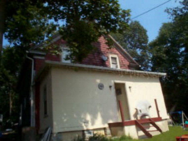 18 Colbert Avenue Oil City, PA 16301 - Photo 1 of 1 a side view of a house with a tree