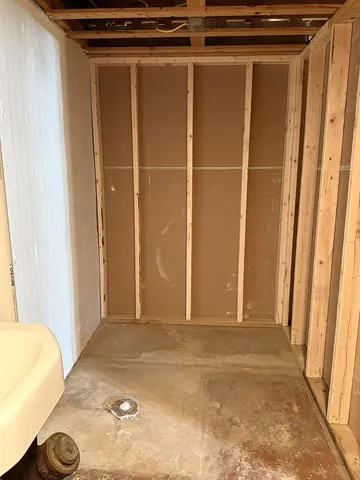 a view of a room with wooden walls