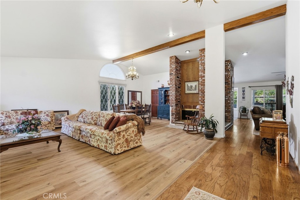 18233 Charlton Lane Porter Ranch, CA 91326 - Photo 27 of 40 a living room with furniture and wooden floor
