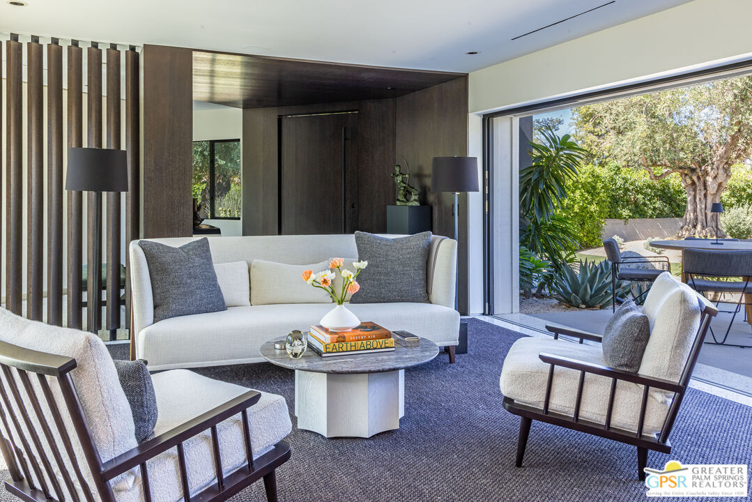 72453 Rancho Road Rancho Mirage, CA 92270 - Photo 18 of 60 a outdoor living space with furniture and a potted plant