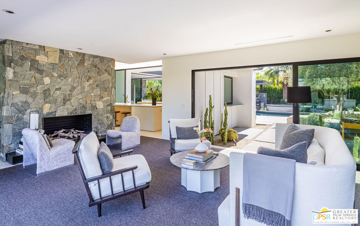 72453 Rancho Road Rancho Mirage, CA 92270 - Photo 20 of 60 a living room with furniture and a large window