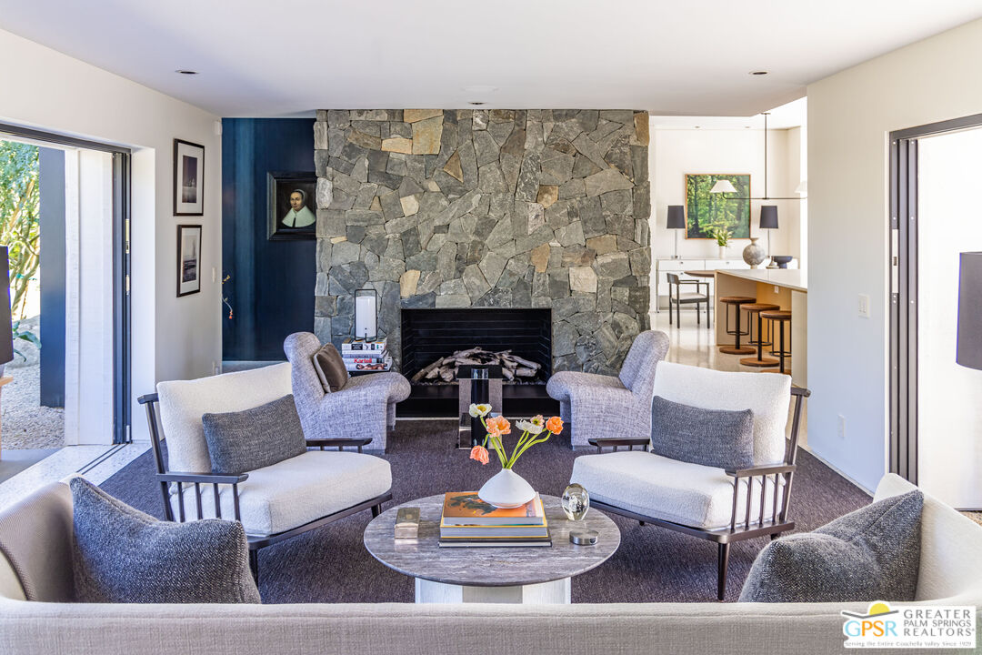 72453 Rancho Road Rancho Mirage, CA 92270 - Photo 21 of 60 a living room with furniture and a fireplace
