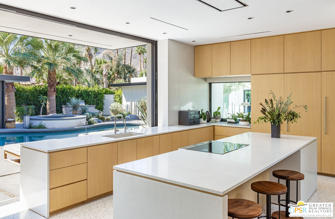 72453 Rancho Road Rancho Mirage, CA 92270 - Photo 24 of 60 a kitchen with a sink and a large window