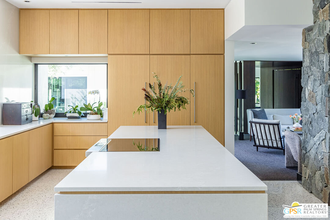 72453 Rancho Road Rancho Mirage, CA 92270 - Photo 25 of 60 a large white kitchen with a large window