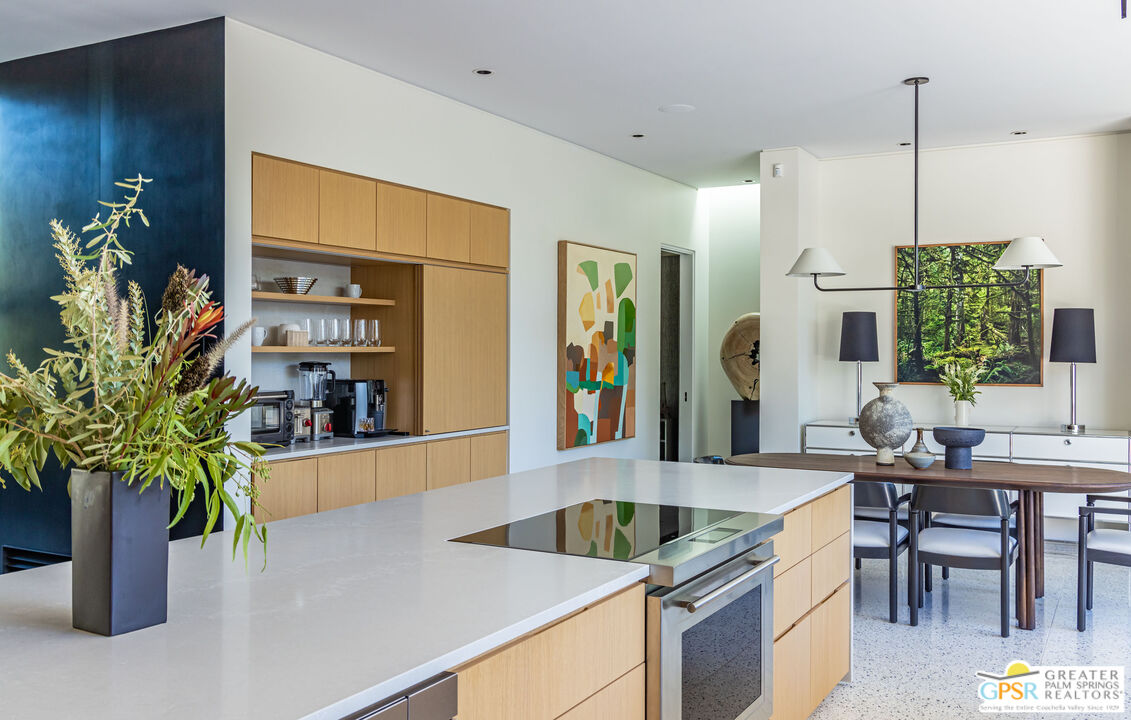 72453 Rancho Road Rancho Mirage, CA 92270 - Photo 26 of 60 a kitchen with a potted plant on the counter and a sink