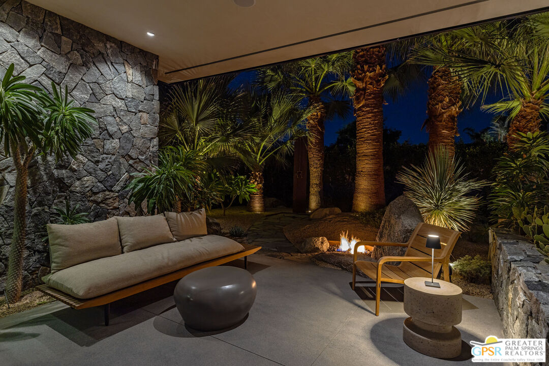 72453 Rancho Road Rancho Mirage, CA 92270 - Photo 55 of 60 a living room with furniture and a potted plant