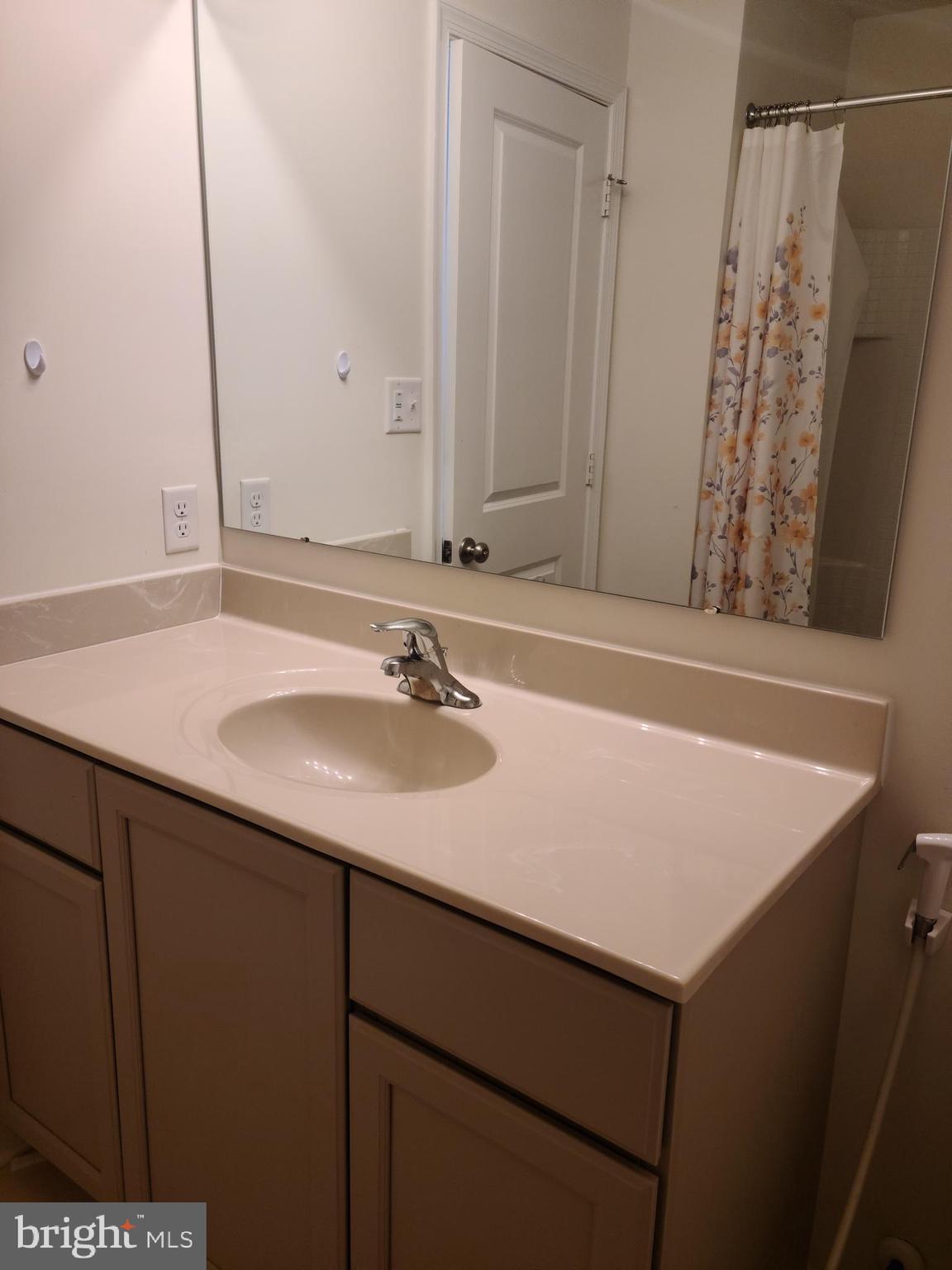 1756 Michelangelo Drive Middletown, DE 19709 - Photo 14 of 24 a bathroom with a sink and a mirror
