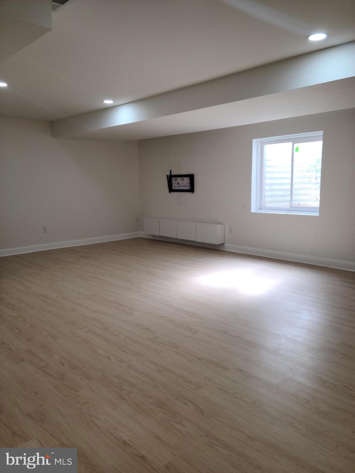 1756 Michelangelo Drive Middletown, DE 19709 - Photo 20 of 24 an empty room with wooden floor and windows