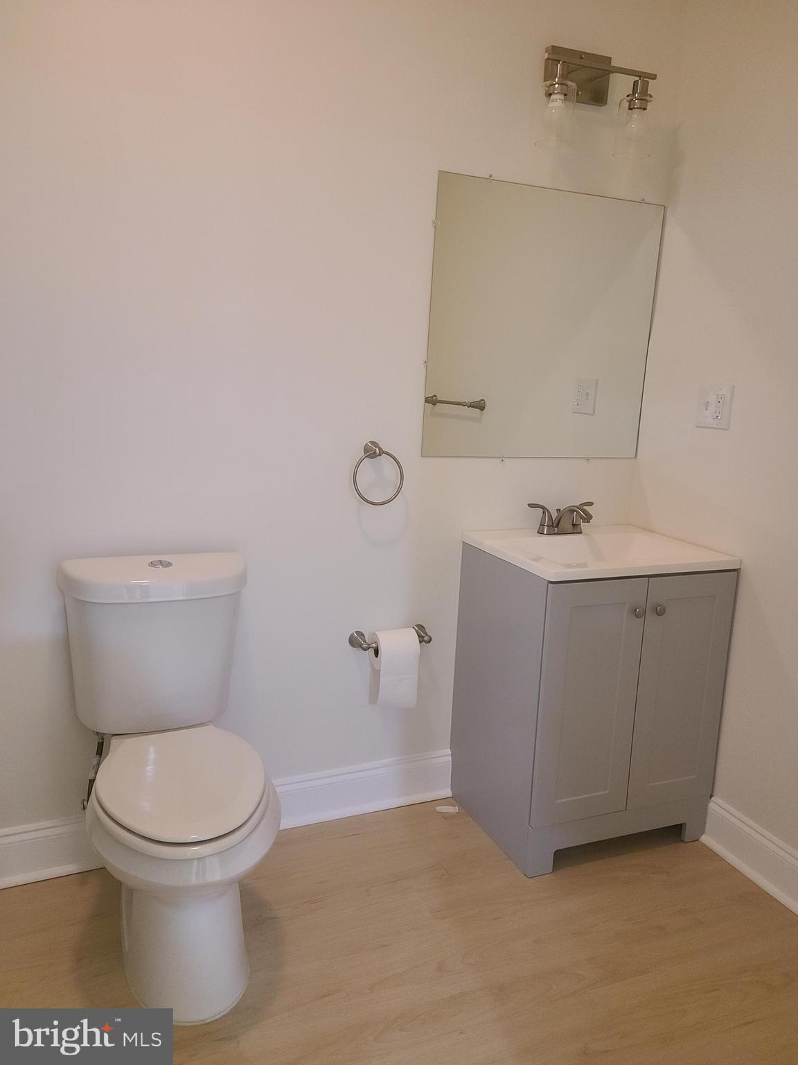 1756 Michelangelo Drive Middletown, DE 19709 - Photo 22 of 24 a white toilet sitting next to a bathroom sink