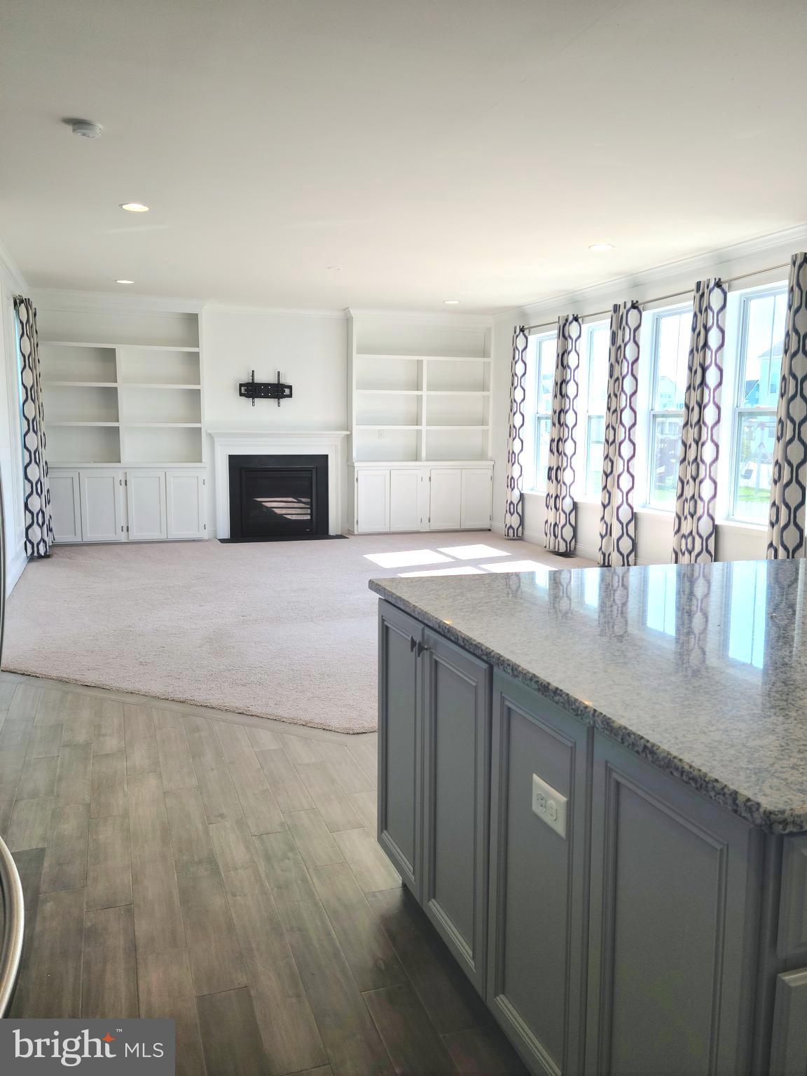 1756 Michelangelo Drive Middletown, DE 19709 - Photo 3 of 24 a view with granite countertop a sink and a stove top oven