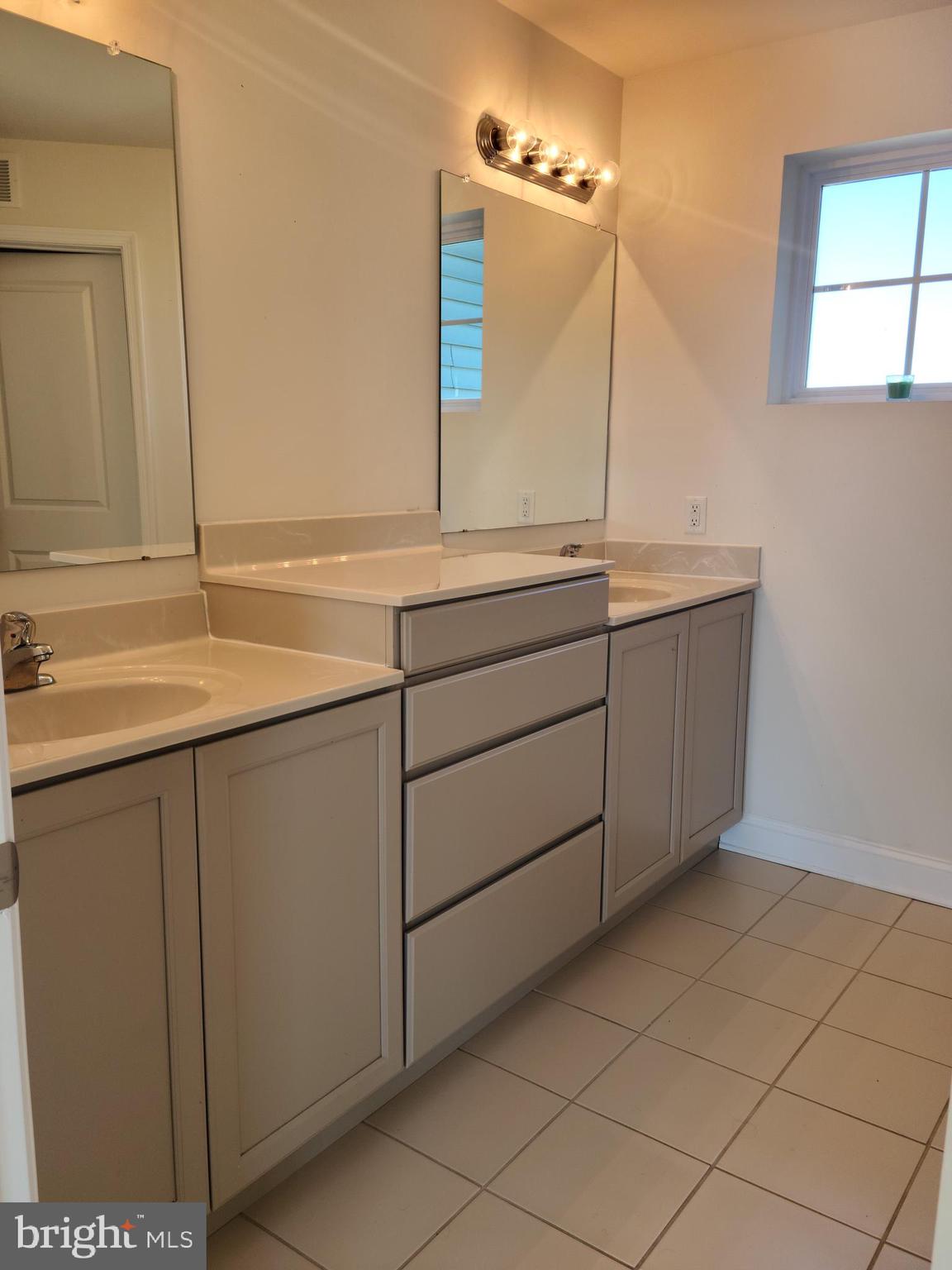 1756 Michelangelo Drive Middletown, DE 19709 - Photo 10 of 24 a bathroom with a sink and a mirror
