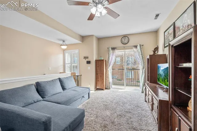 a view of entryway with furniture and wooden floor