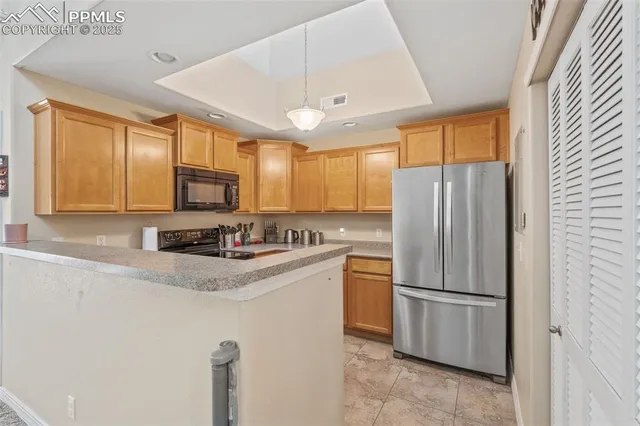 a kitchen with a sink stove top oven and cabinets