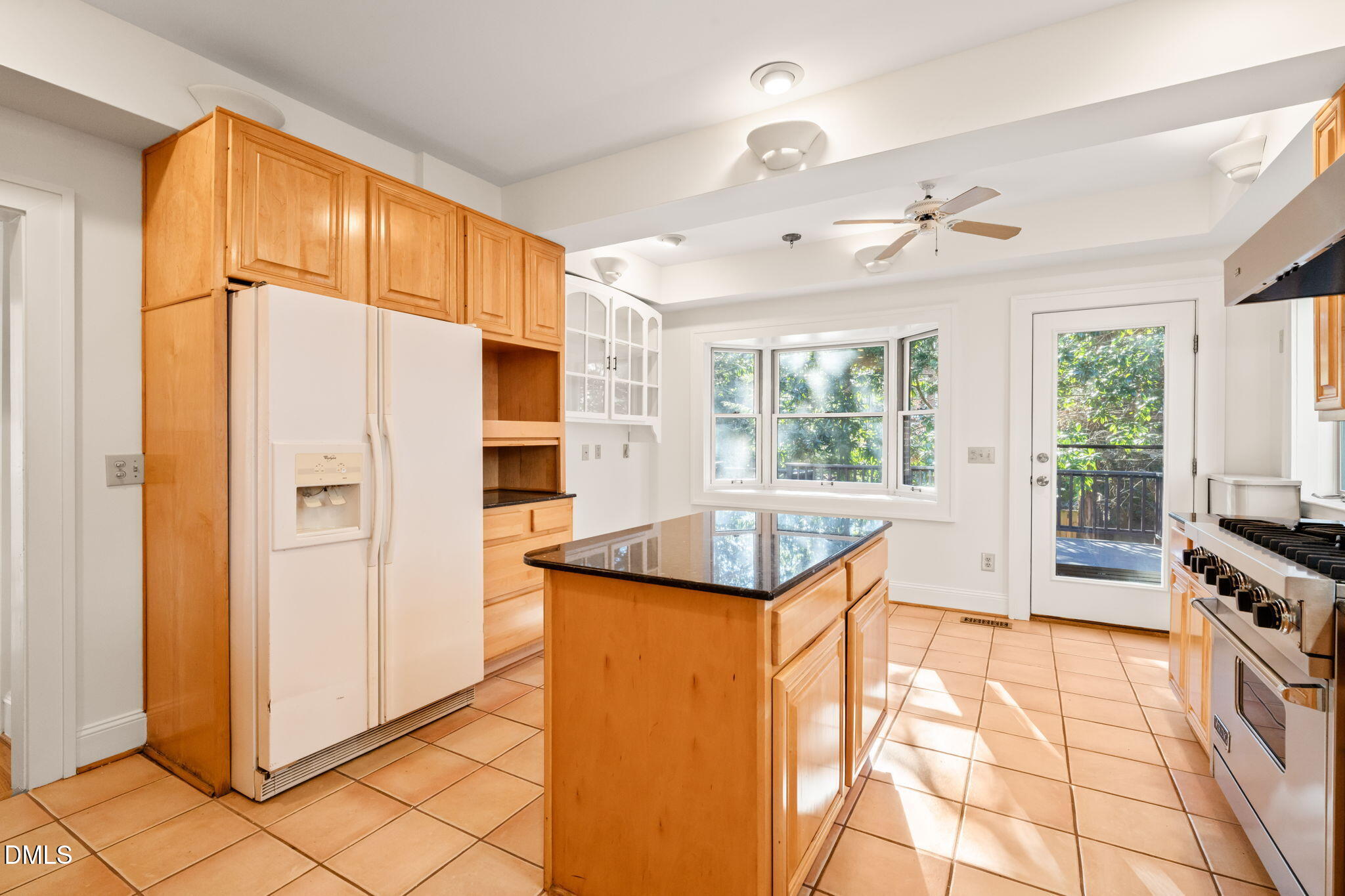 907 West Johnson Street Raleigh, NC 27605 - Photo 14 of 43 a kitchen with stainless steel appliances granite countertop a refrigerator a oven a dining table and chairs with the dresser