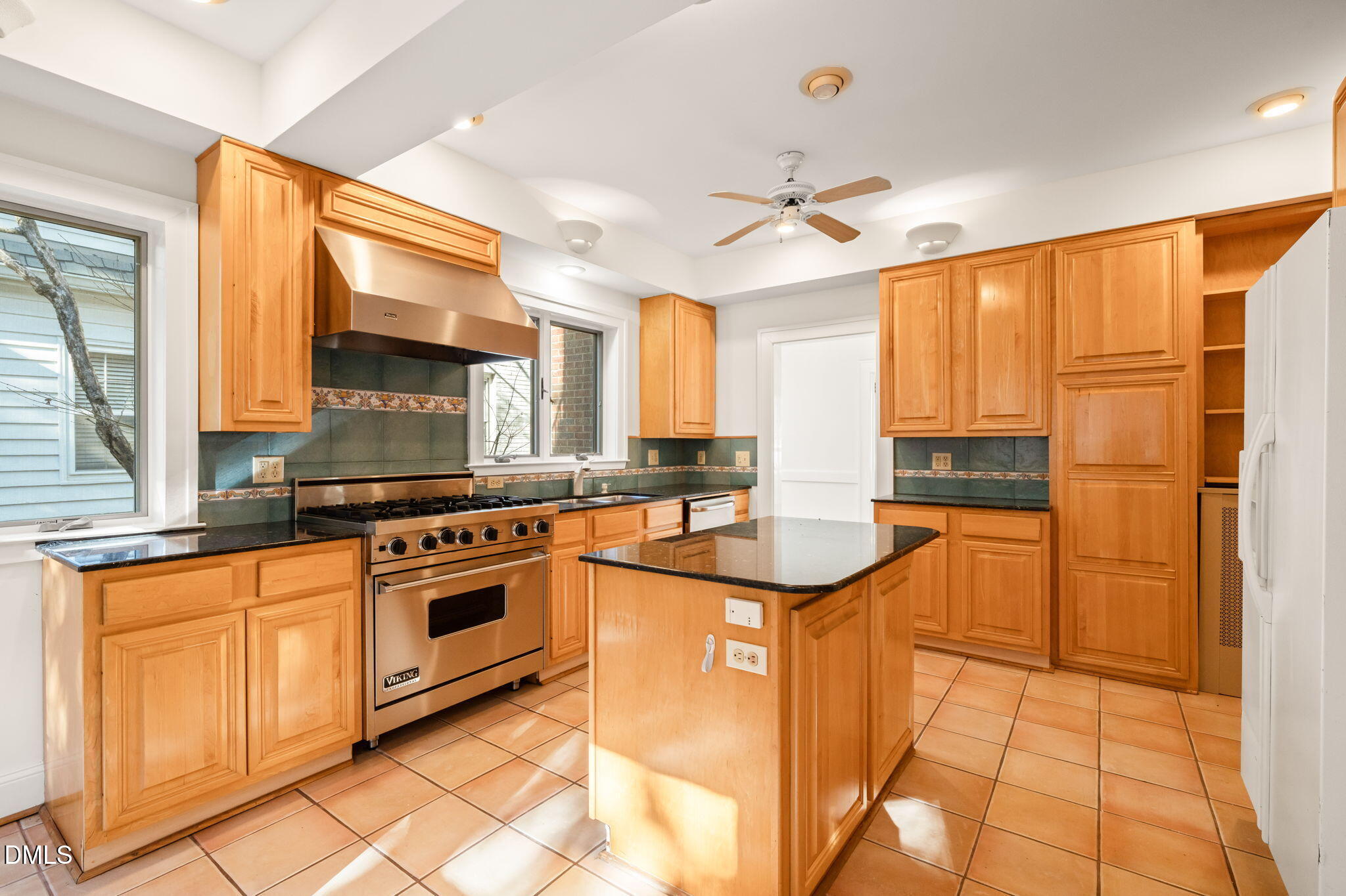 907 West Johnson Street Raleigh, NC 27605 - Photo 15 of 43 a kitchen with stainless steel appliances granite countertop a stove a sink and a refrigerator