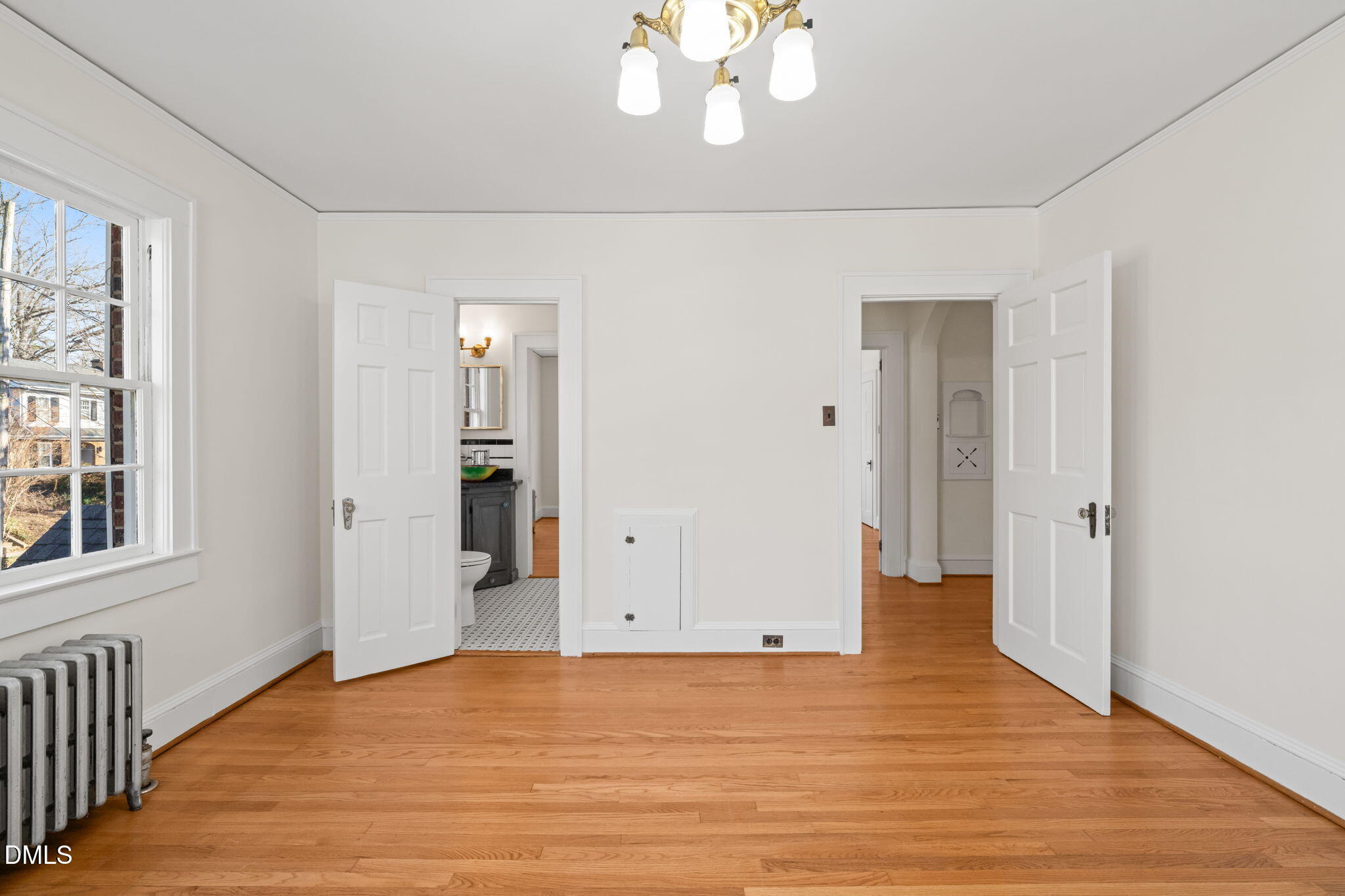 907 West Johnson Street Raleigh, NC 27605 - Photo 22 of 43 a view of an empty room with wooden floor and a window