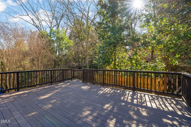 a view of balcony with wooden floor