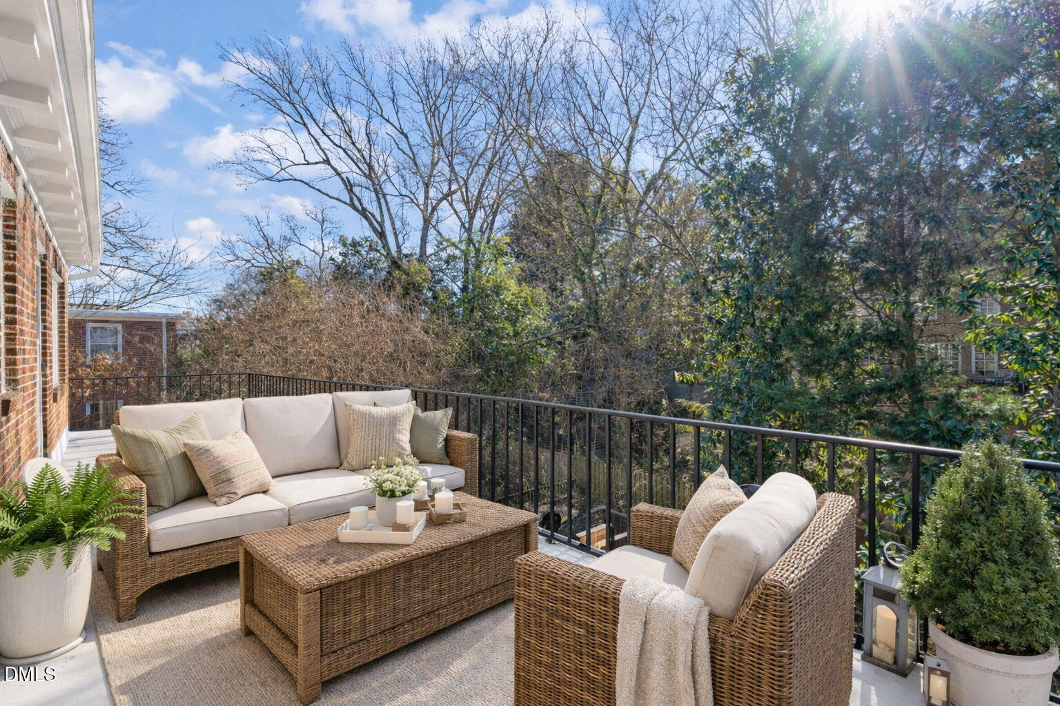 907 West Johnson Street Raleigh, NC 27605 - Photo 3 of 43 a balcony with furniture and potted plants