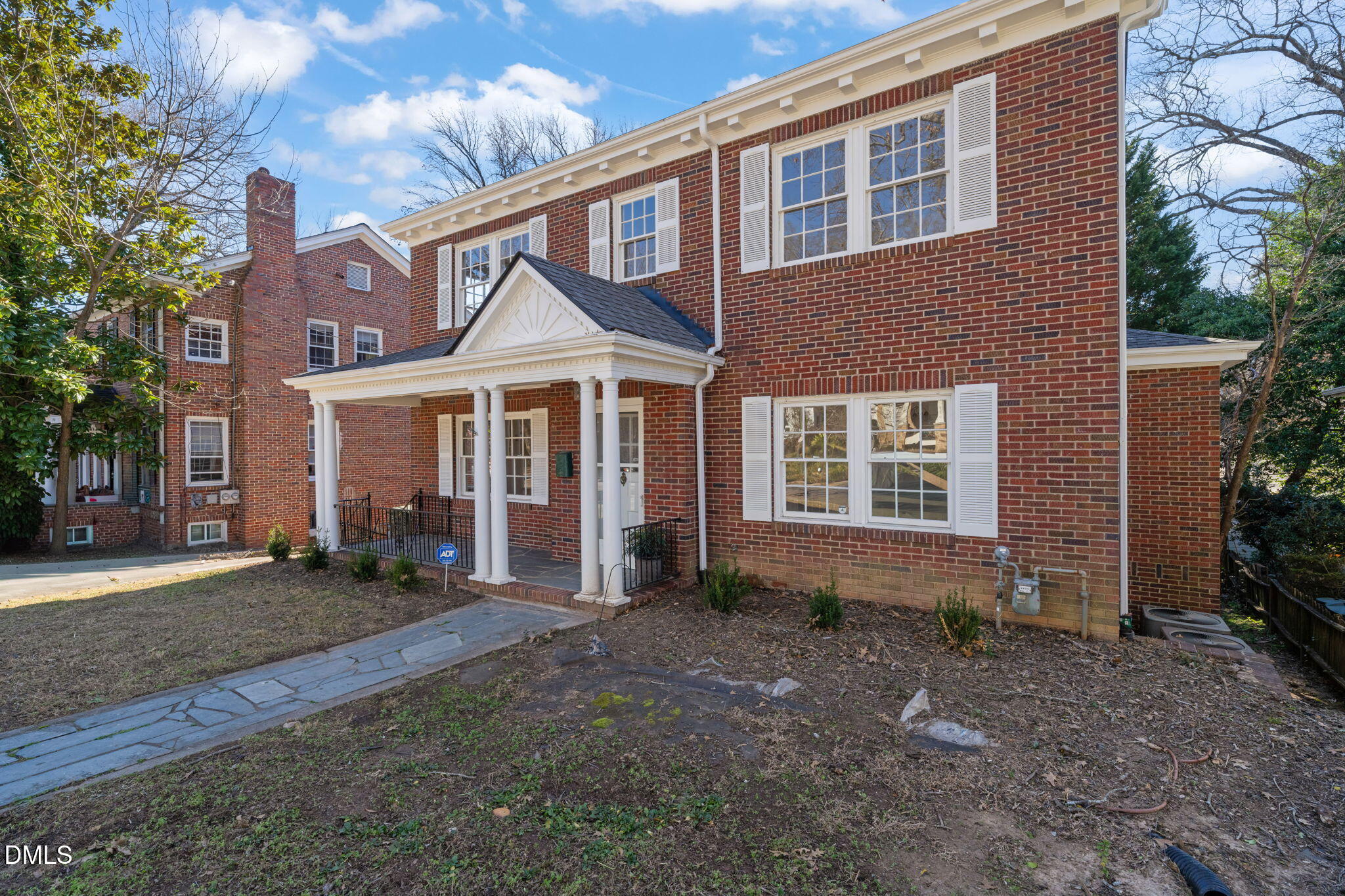907 West Johnson Street Raleigh, NC 27605 - Photo 4 of 43 a front view of a house with a yard