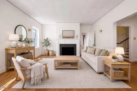 a view of a hallway with wooden floor and a fireplace