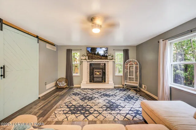 a living room with furniture and a rug