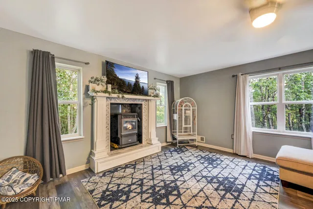 a view of a dining room with furniture and a window