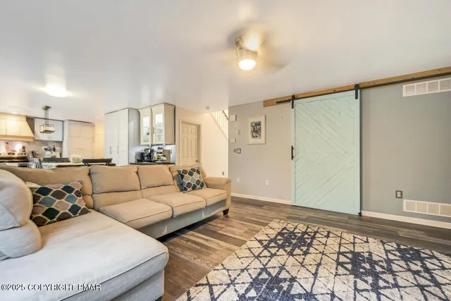 a kitchen with stainless steel appliances a sink stove and cabinets