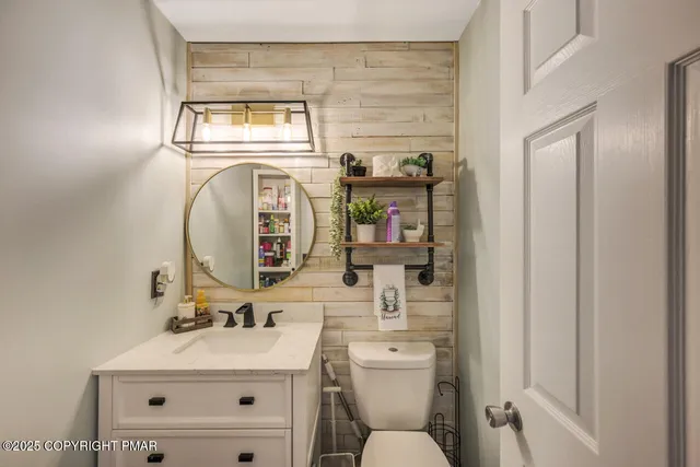 a bedroom with bed and a chandelier