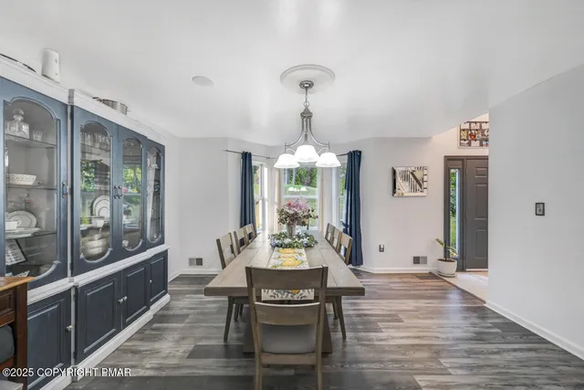 a bedroom with bed and a chandelier