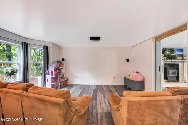 a bathroom with a granite countertop sink a mirror and a shower