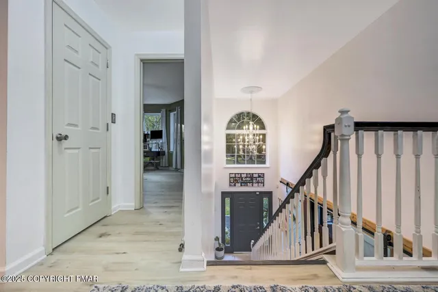 a bathroom with a sink vanity mirror and toilet