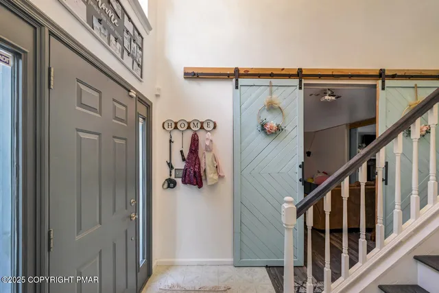 a living room with furniture window and a fireplace