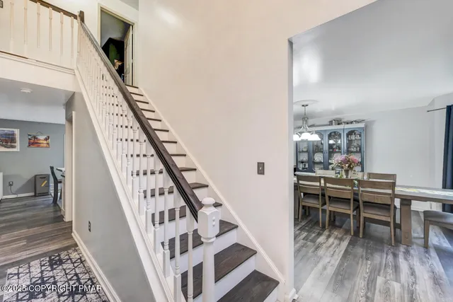 a living room with fireplace furniture and a window