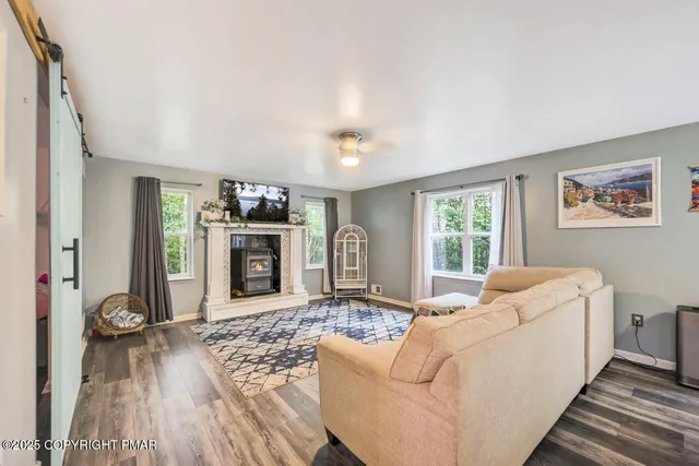 a bedroom with furniture and a window