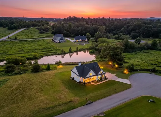 an aerial view of a house with outdoor space
