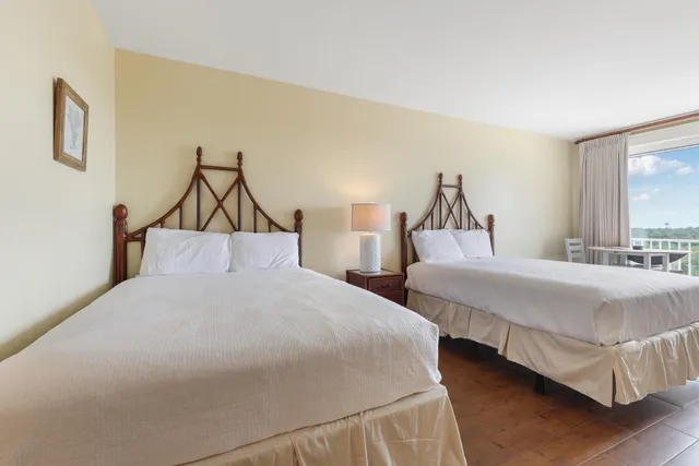 a table and chairs in a room with a window