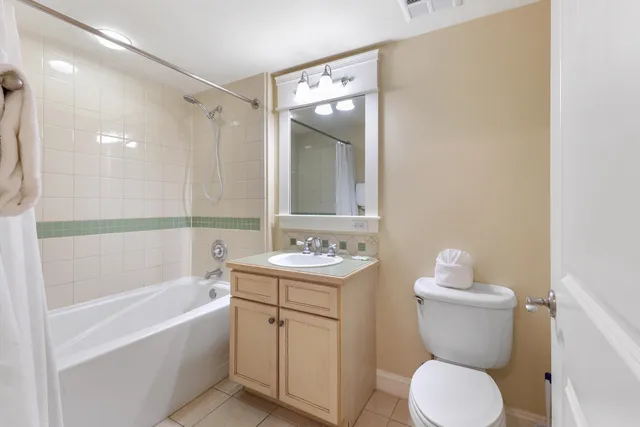 a lobby with furniture and a large mirror