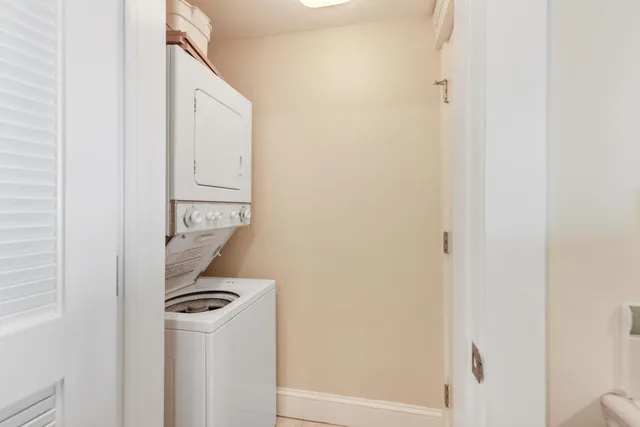 a kitchen with stainless steel appliances granite countertop a sink and a refrigerator