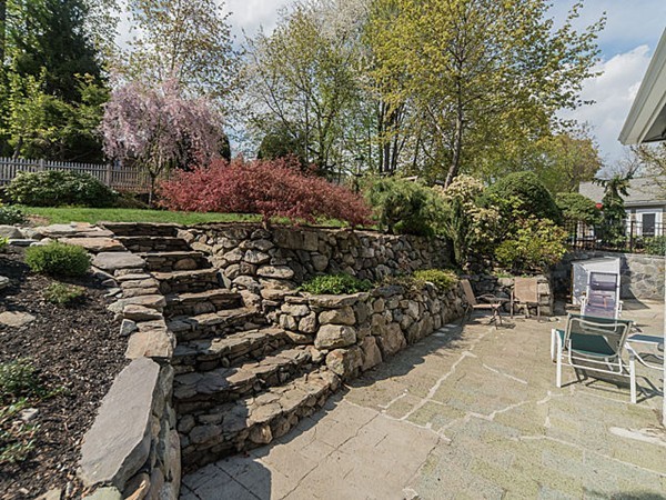 50 Blake Road Brookline, MA 02445 - Photo 15 of 18 a backyard of a house with barbeque oven and outdoor seating